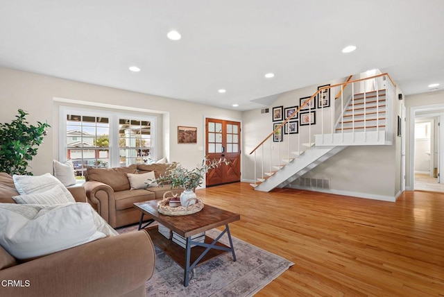 1045 Rotella St, Newbury Park, CA 91320 - living area featuring stairs, light wood-style floors, recessed lighting, and plenty of natural light