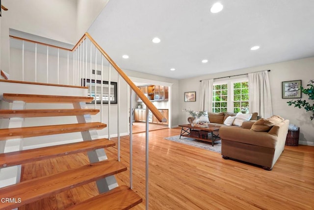 1045 Rotella St, Newbury Park, CA 91320 - living area with stairs, wood finished floors, and recessed lighting