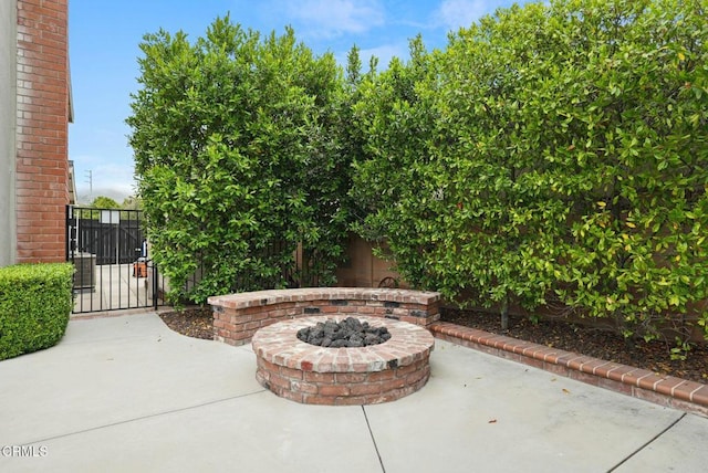 1045 Rotella St, Newbury Park, CA 91320 - view of patio with an outdoor fire pit and a gate