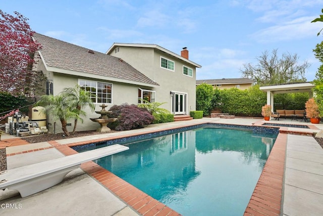 1045 Rotella St, Newbury Park, CA 91320 - view of swimming pool featuring a diving board, a patio area, entry steps, a pool with connected hot tub, and outdoor lounge area