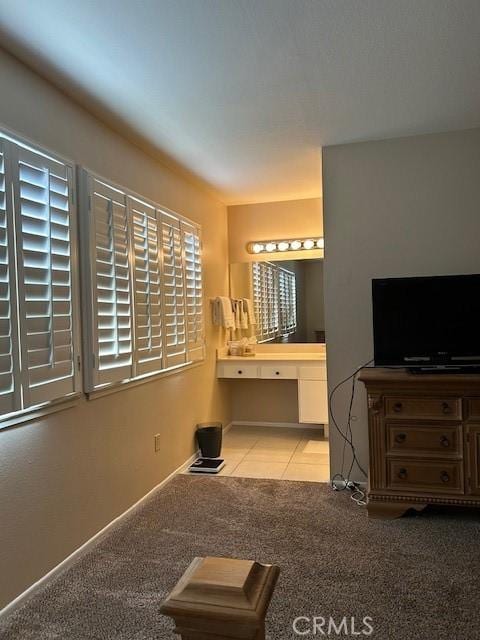 61765 Arroyo Rd Unit 5, Palm Springs, CA 92264 - bedroom with an office area, carpet flooring, and connected bathroom