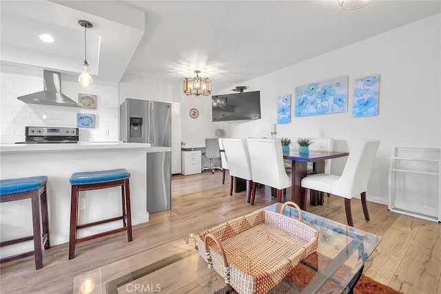 810 Edgewood St Unit 302, Inglewood, CA 90302 - dining area featuring light wood-style floors, a chandelier, recessed lighting, and baseboards