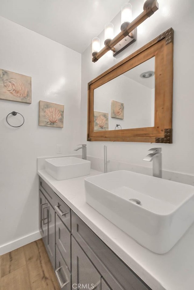 810 Edgewood St Unit 302, Inglewood, CA 90302 - full bathroom with double vanity, wood finished floors, and baseboards