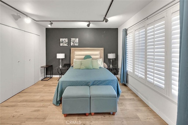 810 Edgewood St Unit 302, Inglewood, CA 90302 - bedroom featuring track lighting, wood finished floors, a closet, and baseboards