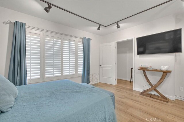 810 Edgewood St Unit 302, Inglewood, CA 90302 - bedroom featuring track lighting, wood finished floors, and baseboards