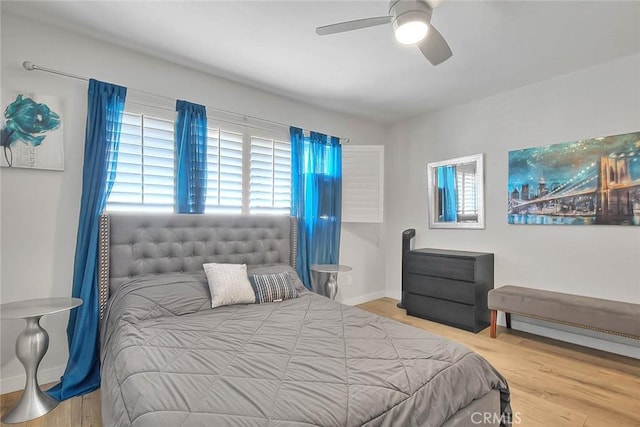 810 Edgewood St Unit 302, Inglewood, CA 90302 - bedroom with multiple windows, wood finished floors, a ceiling fan, and baseboards