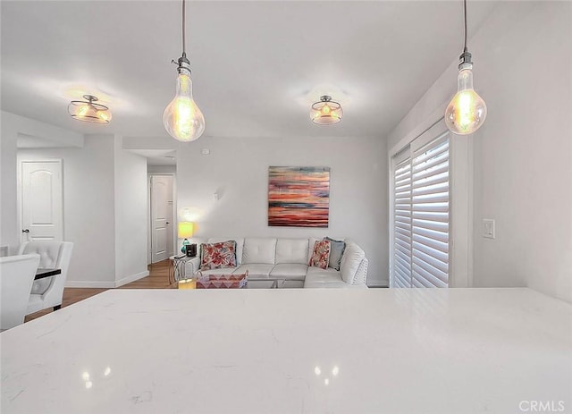 810 Edgewood St Unit 302, Inglewood, CA 90302 - living room featuring baseboards and wood finished floors