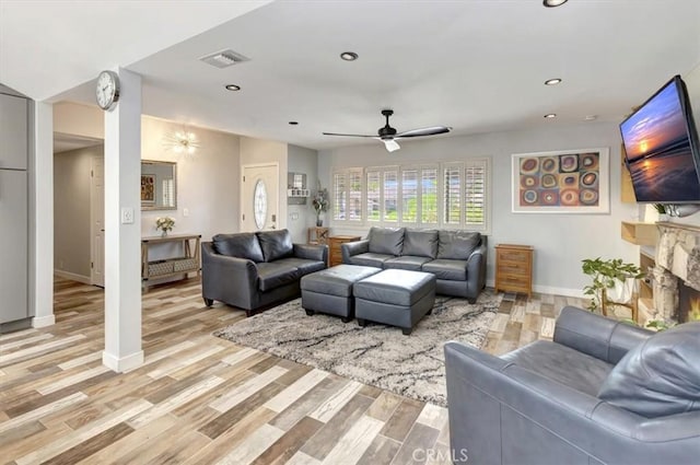 2815 E Coolidge Ave, Orange, CA 92867 - living area featuring a ceiling fan, baseboards, light wood-style flooring, recessed lighting, and a fireplace
