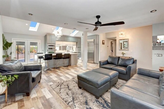 2815 E Coolidge Ave, Orange, CA 92867 - living area with a skylight, light wood finished floors, ceiling fan, and french doors