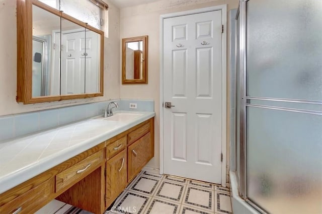 2815 E Coolidge Ave, Orange, CA 92867 - bathroom featuring a stall shower, vanity, and decorative backsplash