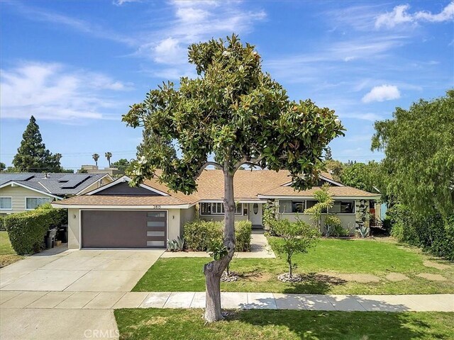 2815 E Coolidge Ave, Orange, CA 92867 - single story home with stucco siding, concrete driveway, a front yard, a garage, and a shingled roof