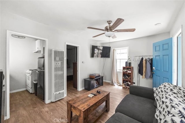 632 Leebert Way, Crestline, CA 92325 - living area featuring a heating unit, ceiling fan, wood finished floors, and baseboards