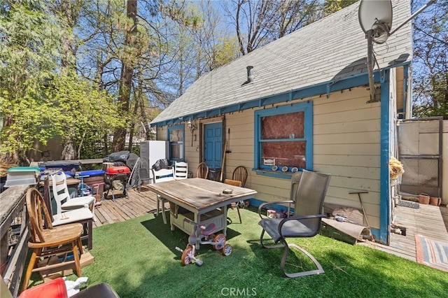 632 Leebert Way, Crestline, CA 92325 - back of house featuring a deck, a shingled roof, and a lawn