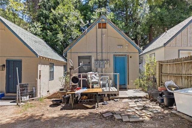632 Leebert Way, Crestline, CA 92325 - back of house with a deck, an outdoor structure, and stucco siding