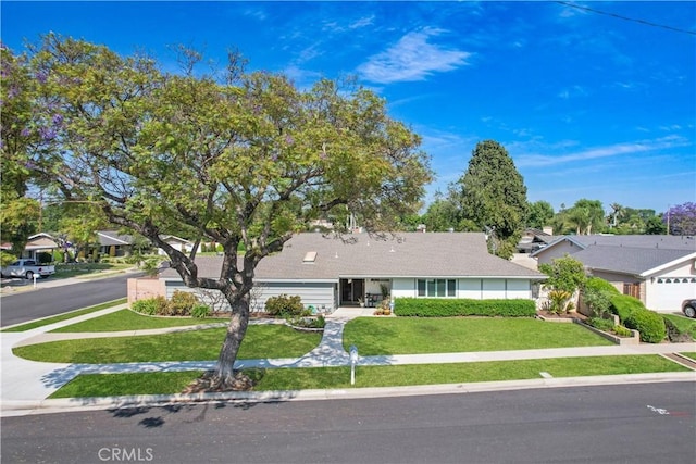 14242 Clarissa Ln, North Tustin, CA 92705 - ranch-style house with a front lawn, a garage, and driveway