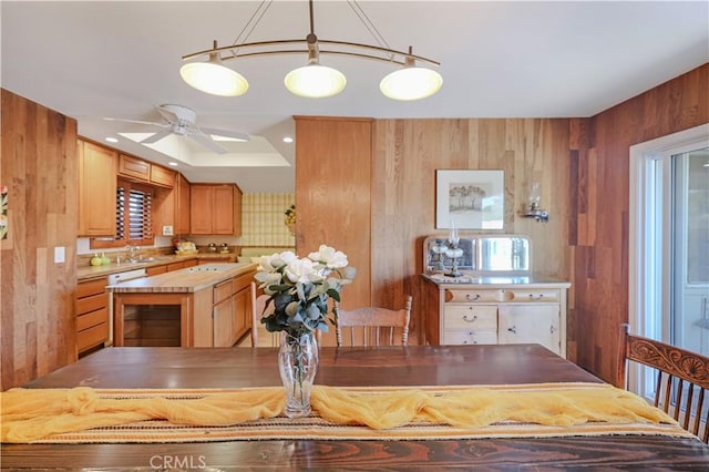 14242 Clarissa Ln, North Tustin, CA 92705 - dining area with wooden walls and a ceiling fan