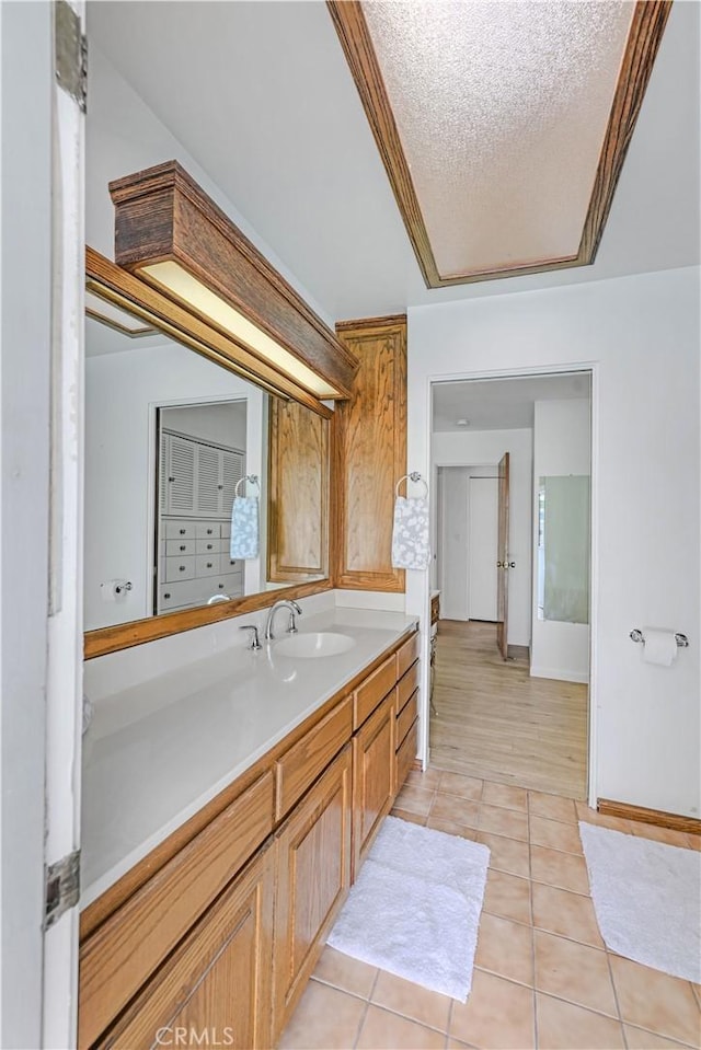 14242 Clarissa Ln, North Tustin, CA 92705 - bathroom with vanity, tile patterned floors, and a textured ceiling