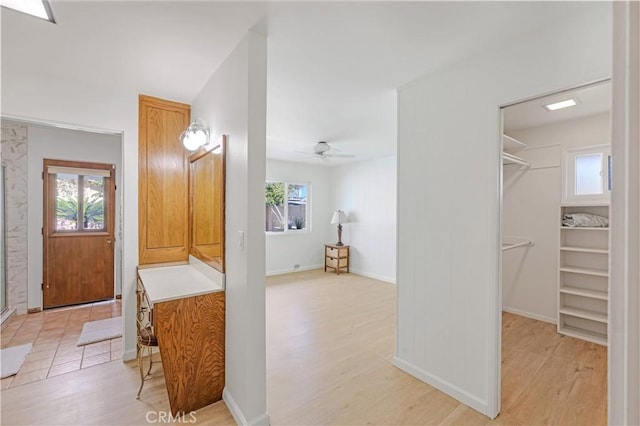 14242 Clarissa Ln, North Tustin, CA 92705 - full bathroom featuring a spacious closet, wood finished floors, a ceiling fan, vanity, and a shower stall