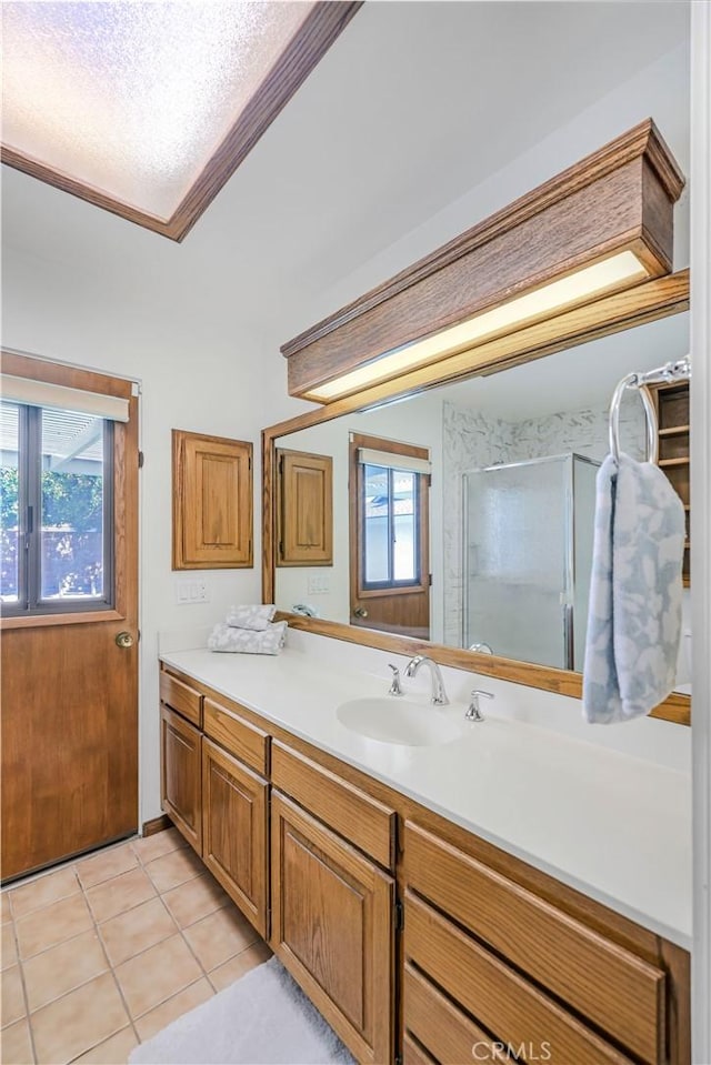 14242 Clarissa Ln, North Tustin, CA 92705 - bathroom featuring vanity, tile patterned flooring, and a shower with shower door