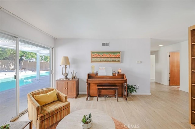14242 Clarissa Ln, North Tustin, CA 92705 - sitting room with light wood finished floors and baseboards