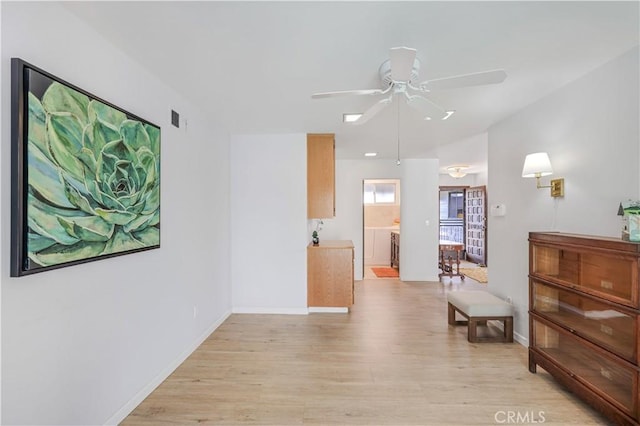 14242 Clarissa Ln, North Tustin, CA 92705 - hall with light wood-style flooring and baseboards