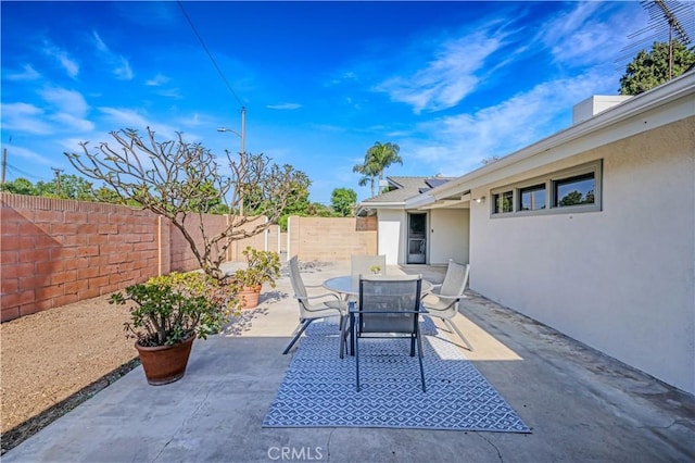 14242 Clarissa Ln, North Tustin, CA 92705 - fenced backyard featuring a patio and outdoor dining area