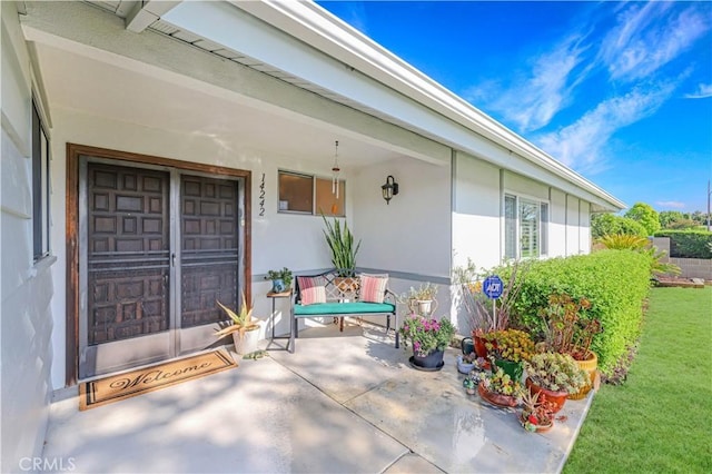 14242 Clarissa Ln, North Tustin, CA 92705 - entrance to property with stucco siding and a yard