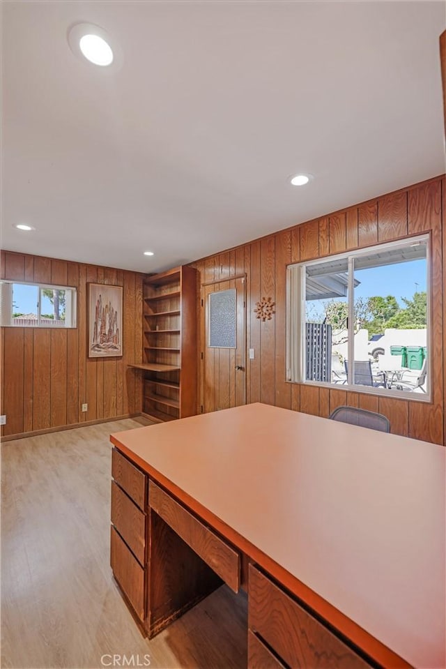 14242 Clarissa Ln, North Tustin, CA 92705 - kitchen featuring wood walls, brown cabinets, light countertops, light wood-style floors, and recessed lighting