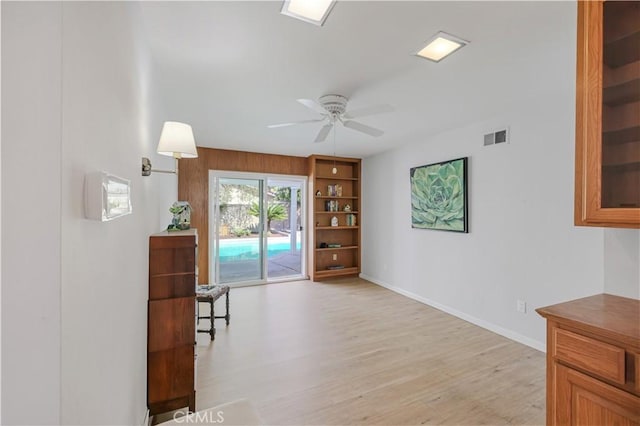 14242 Clarissa Ln, North Tustin, CA 92705 - sitting room with light wood-style floors, ceiling fan, and baseboards