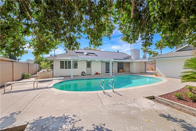 14242 Clarissa Ln, North Tustin, CA 92705 - view of pool with a patio, a fenced backyard, and a diving board
