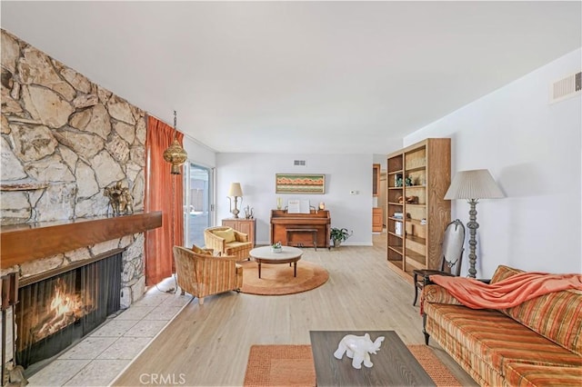 14242 Clarissa Ln, North Tustin, CA 92705 - living area with a stone fireplace and wood finished floors