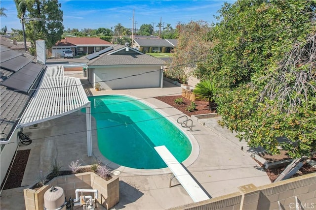 14242 Clarissa Ln, North Tustin, CA 92705 - view of pool with a diving board, a patio area, a fenced backyard, and a residential view