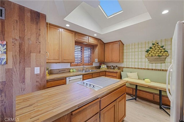 14242 Clarissa Ln, North Tustin, CA 92705 - kitchen with wood counters, wallpapered walls, white appliances, recessed lighting, and a sink