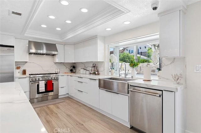 2160 S Hammatt, Anaheim, CA 92802 - kitchen with wall chimney exhaust hood, stainless steel appliances, a sink, crown molding, and recessed lighting