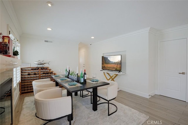 2160 S Hammatt, Anaheim, CA 92802 - dining room with light wood finished floors, ornamental molding, baseboards, recessed lighting, and a fireplace