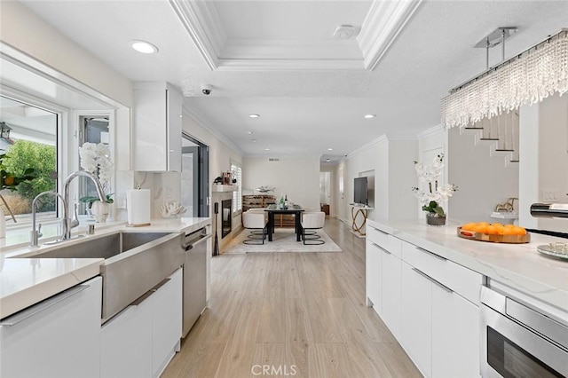 2160 S Hammatt, Anaheim, CA 92802 - kitchen featuring ornamental molding, a sink, appliances with stainless steel finishes, white cabinets, and modern cabinets