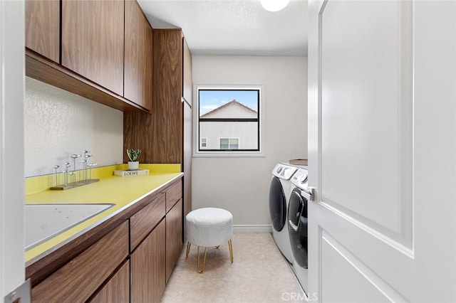 2160 S Hammatt, Anaheim, CA 92802 - laundry area featuring independent washer and dryer, cabinet space, and baseboards