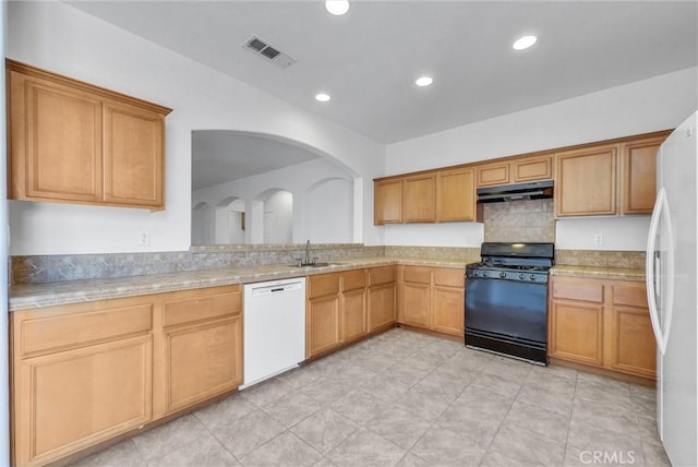 1760 Terrace Ave, Colton, CA 92324 - kitchen with dishwasher, black gas range, freestanding refrigerator, under cabinet range hood, and light countertops