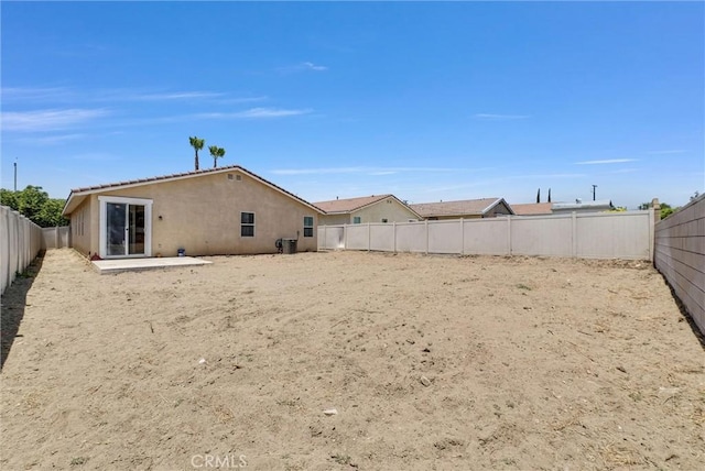 1760 Terrace Ave, Colton, CA 92324 - back of property with stucco siding and a fenced backyard