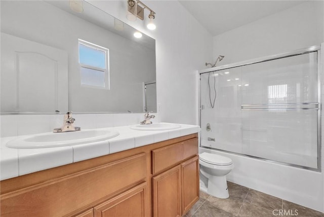 1760 Terrace Ave, Colton, CA 92324 - full bath featuring double vanity, bath / shower combo with glass door, and tile patterned flooring