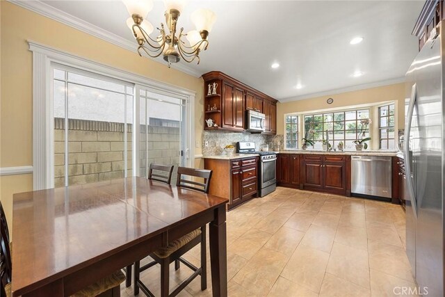 4541 Amberwood Ave, La Palma, CA 90623 - kitchen featuring stainless steel appliances, a chandelier, crown molding, tasteful backsplash, and recessed lighting