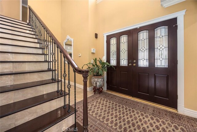4541 Amberwood Ave, La Palma, CA 90623 - foyer entrance featuring baseboards, stairs, a high ceiling, and crown molding
