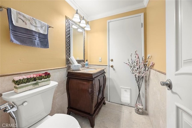 4541 Amberwood Ave, La Palma, CA 90623 - bathroom with toilet, crown molding, vanity, wainscoting, and tile patterned flooring