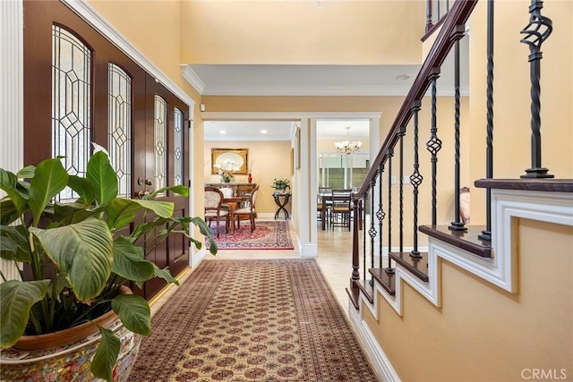 4541 Amberwood Ave, La Palma, CA 90623 - foyer entrance featuring stairs, a chandelier, crown molding, and baseboards