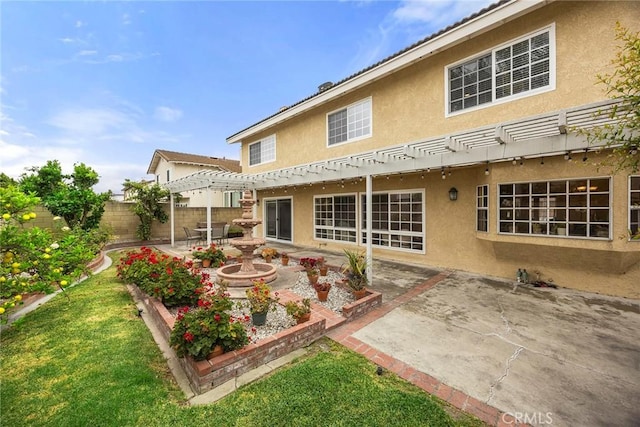 4541 Amberwood Ave, La Palma, CA 90623 - back of house featuring a pergola, stucco siding, and a patio