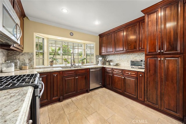 4541 Amberwood Ave, La Palma, CA 90623 - kitchen featuring stainless steel appliances, a sink, tasteful backsplash, ornamental molding, and light stone counters