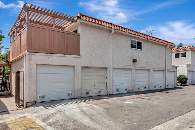 31278 Calle San Juan Unit 12F, San Juan Capistrano, CA 92675 - view of side of property with stucco siding and a tile roof