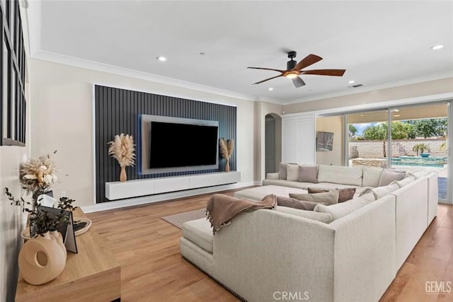 12312 Ashlyn Dr, Bakersfield, CA 93311 - living room with crown molding, a ceiling fan, arched walkways, recessed lighting, and wood finished floors