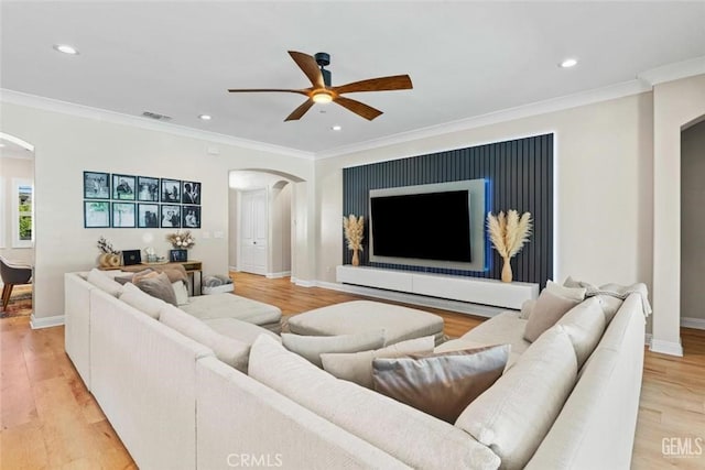 12312 Ashlyn Dr, Bakersfield, CA 93311 - living area with arched walkways, ceiling fan, ornamental molding, recessed lighting, and baseboards
