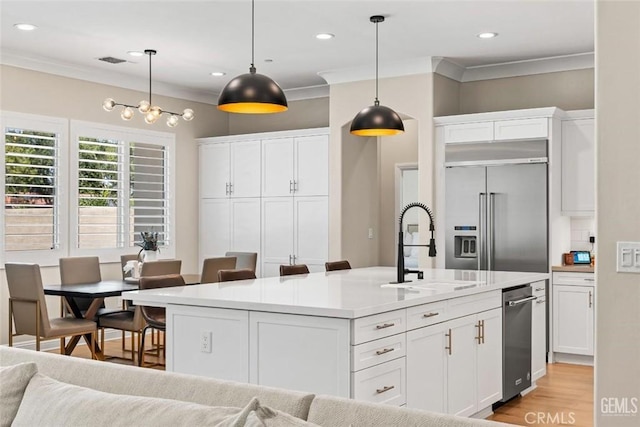 12312 Ashlyn Dr, Bakersfield, CA 93311 - kitchen featuring stainless steel built in fridge, a sink, ornamental molding, white cabinetry, and recessed lighting
